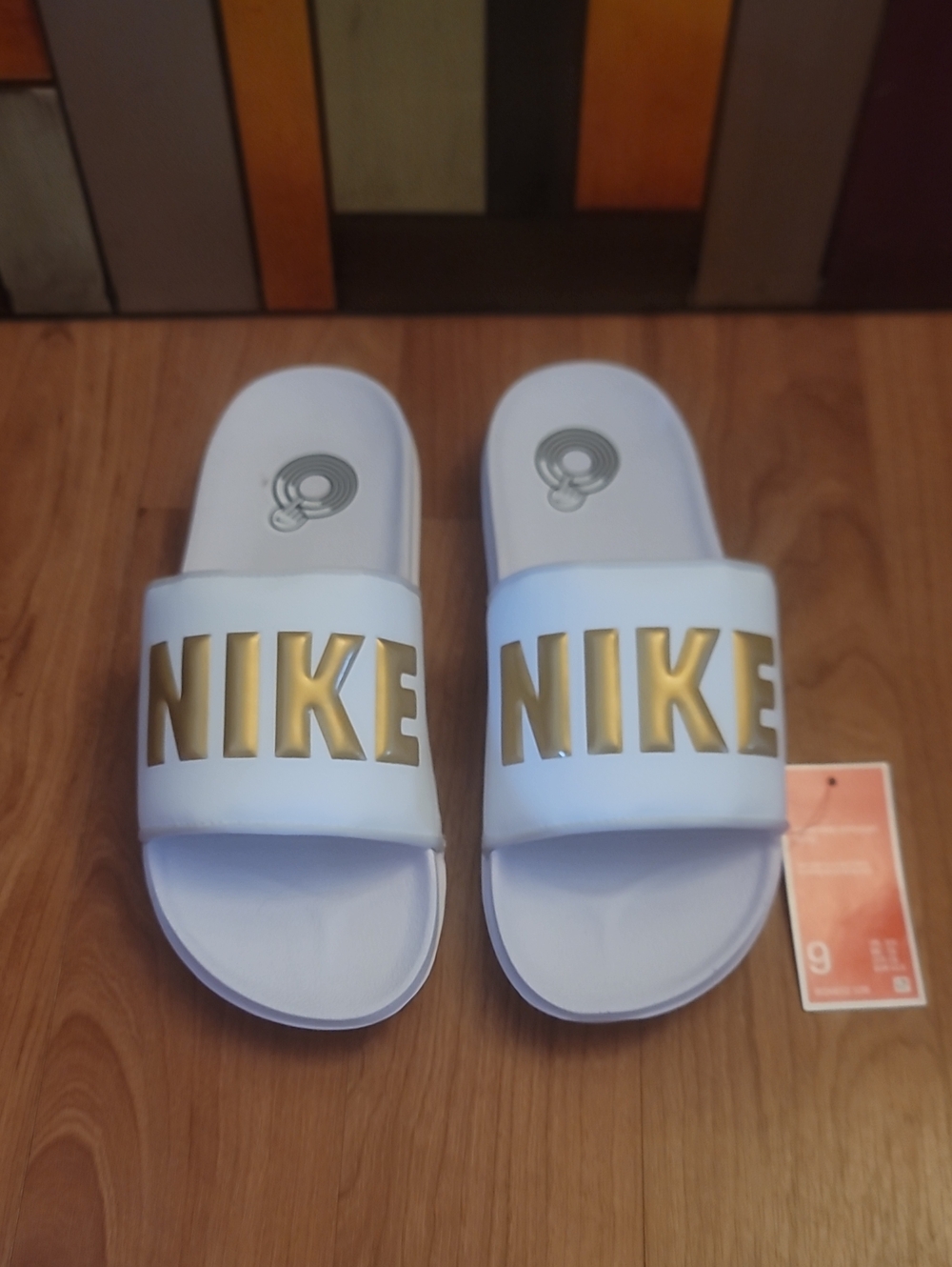 Nike White Womens Slides with Gold NIKE Logo
